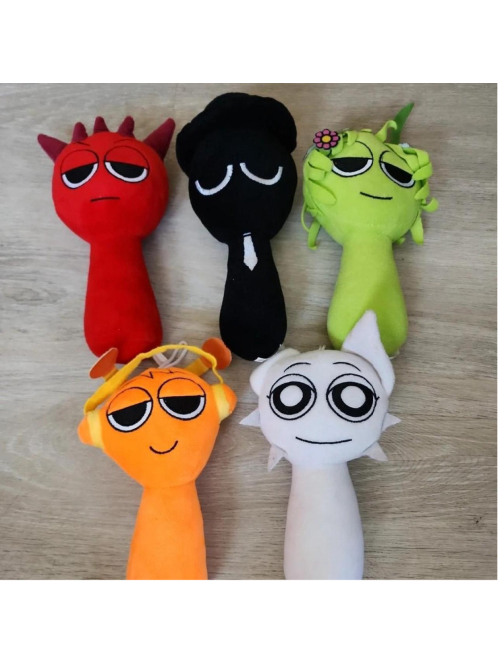 5pcs Spunki Plush Dolls
Red, black, green, orange, and white plush dolls with ca